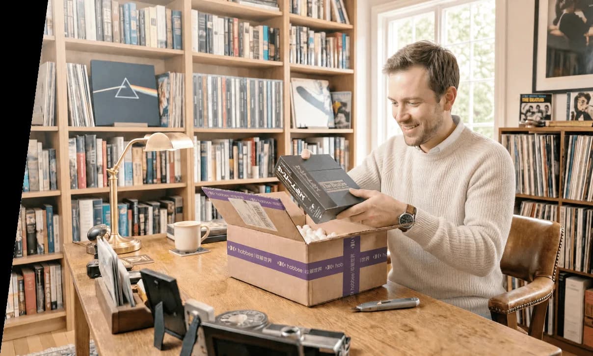 A collector unpacking a parcel of records at his desk